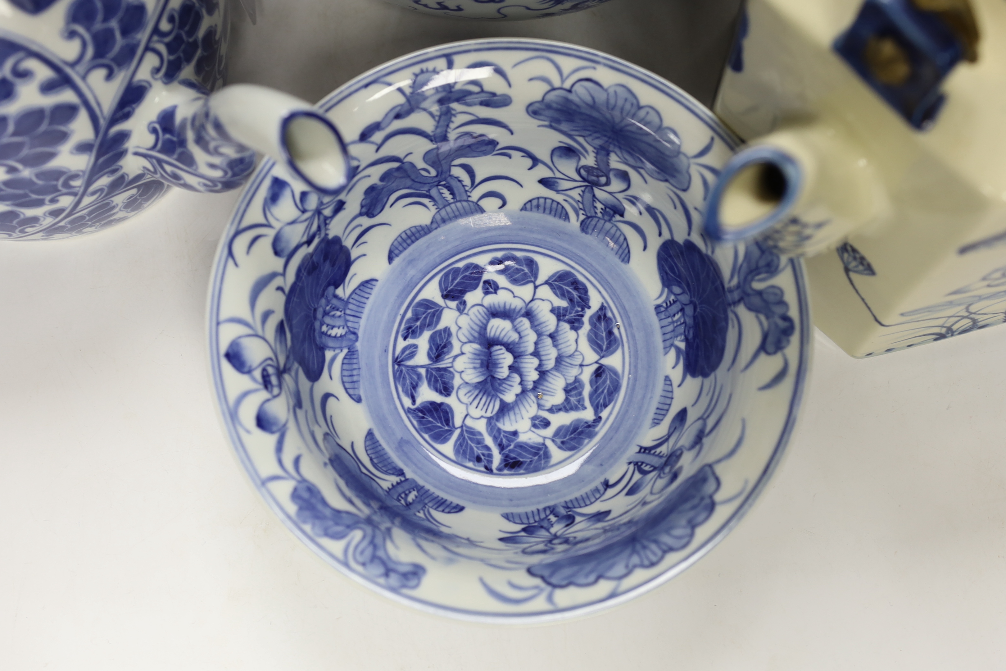 Four modern Chinese blue and white ceramic items; two teapots, a lidded vessel and a bowl, tallest 23.5cm